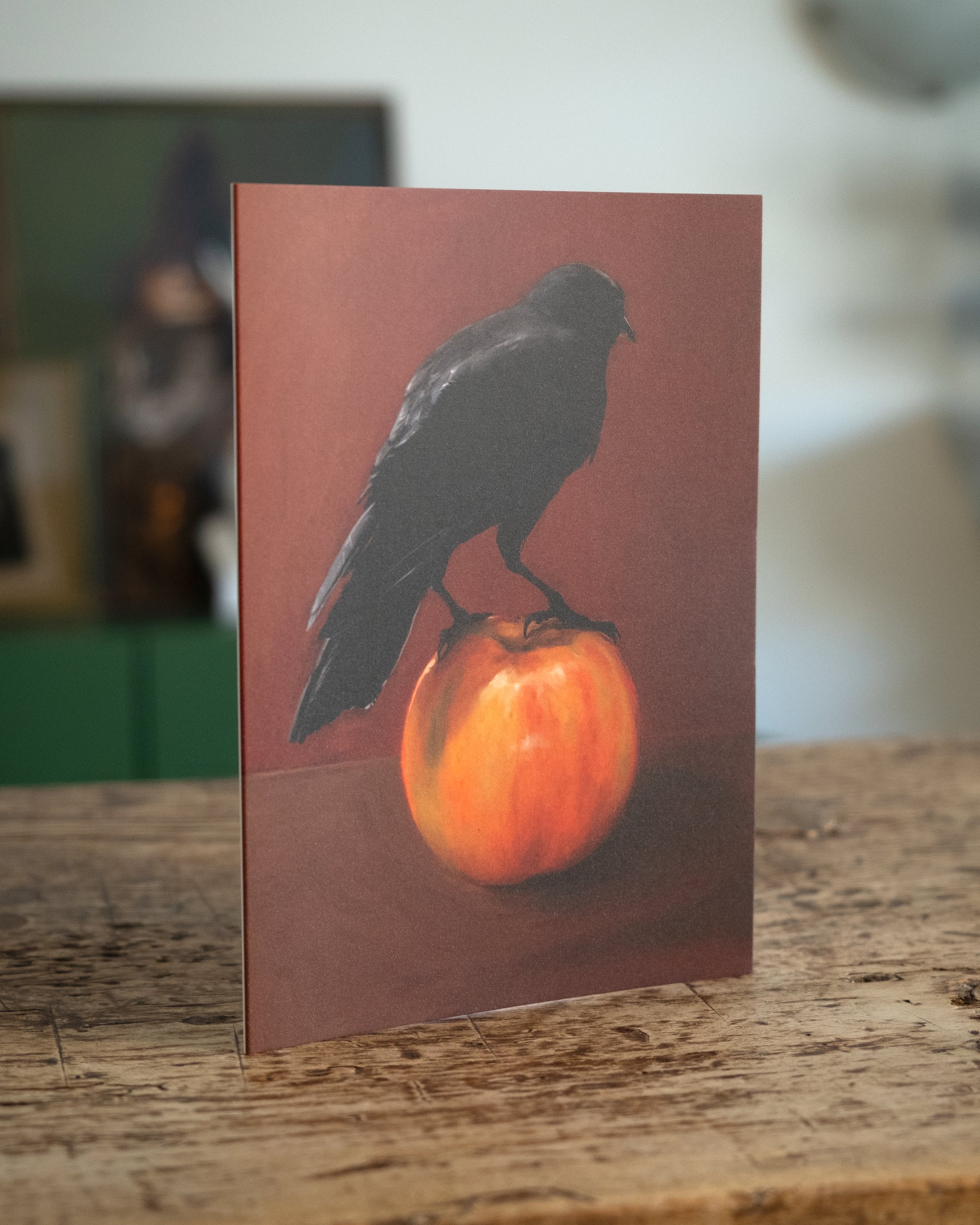 "Crownelius Crowmwell" by Catherine Hébert - Black Crow on Apple - Blank 5"x7" Greeting Card