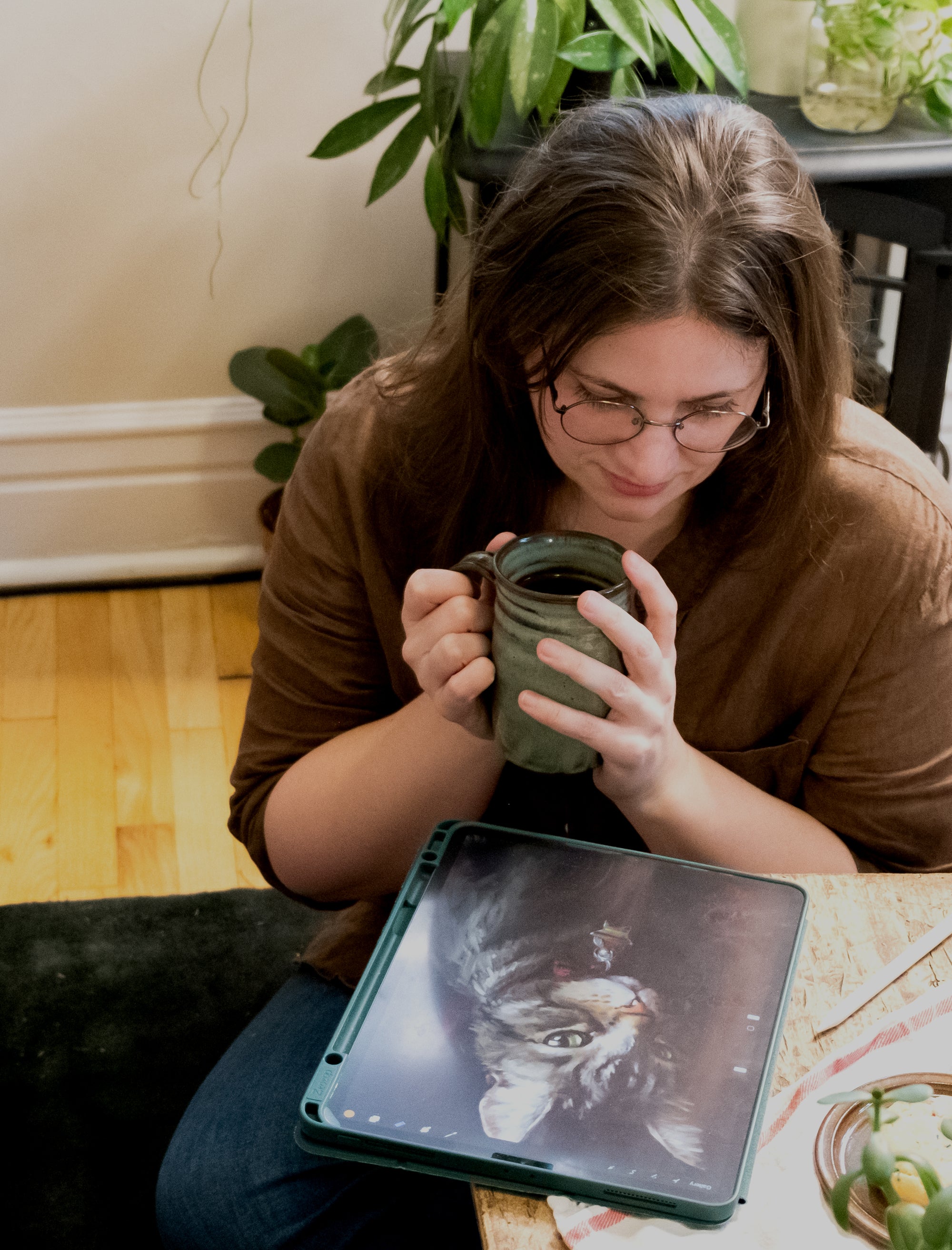 Catherine Hébert illustrating on an iPad in her Montreal studio