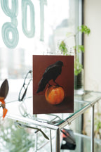 "Crownelius Crowmwell" by Catherine Hébert - Black Crow on Apple - Blank 5"x7" Greeting Card
