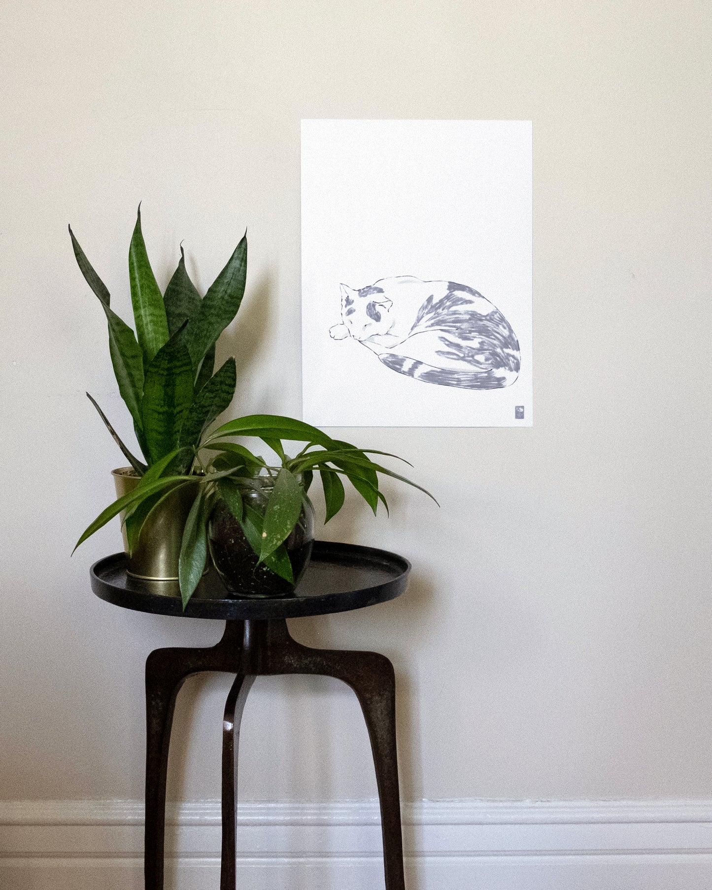 The Original Russell art print unframed with a plant