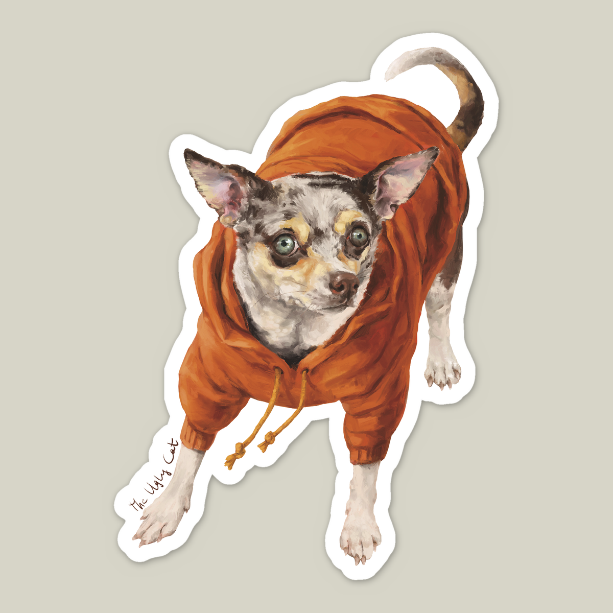 Die-cut vinyl sticker of a Chihuahua in an orange hoodie by The Ugly Cat Studio